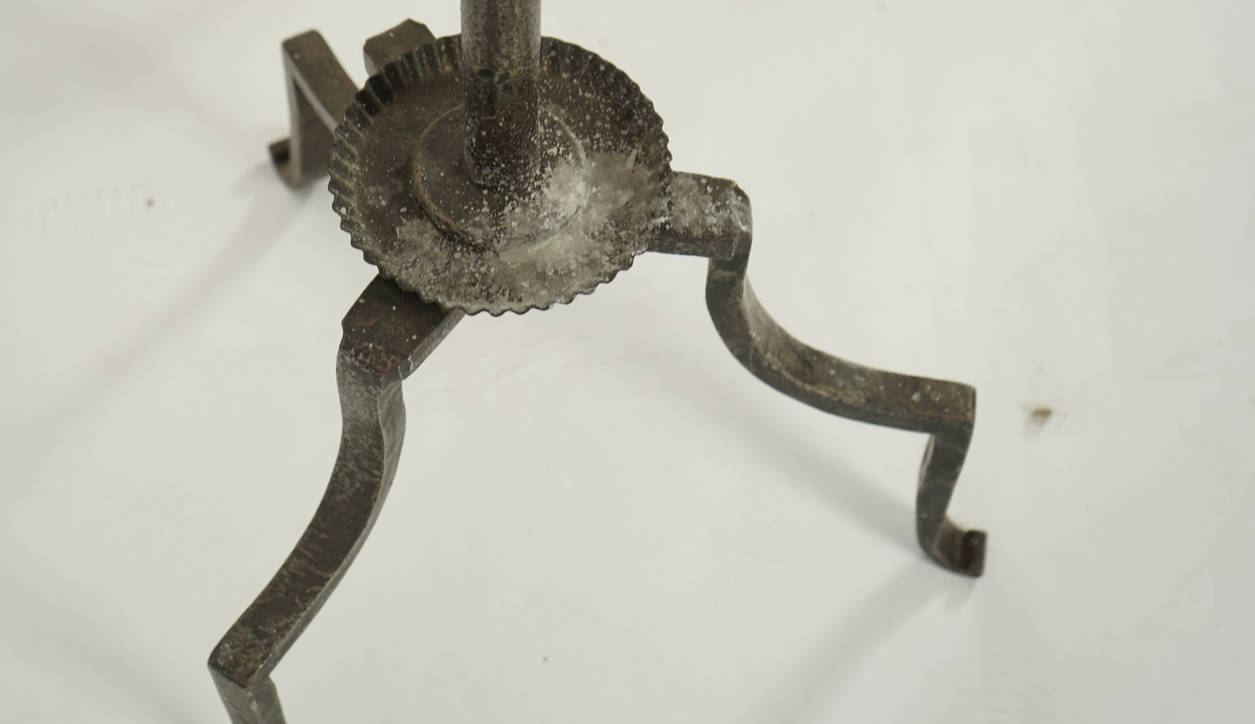 A pair of standing iron pricket candlesticks